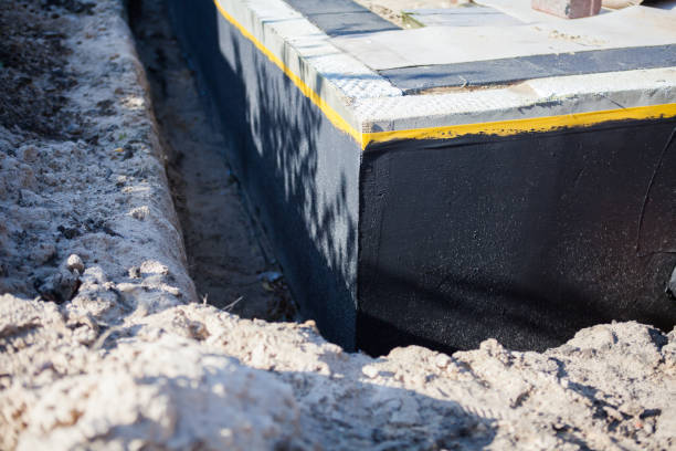 Professional Waterproofing technician working in Taylor, MI